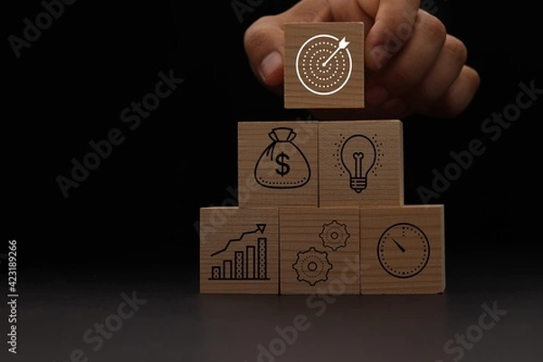 Obraz Concept of business strategy and action plan. Wood cube block stacking with icon