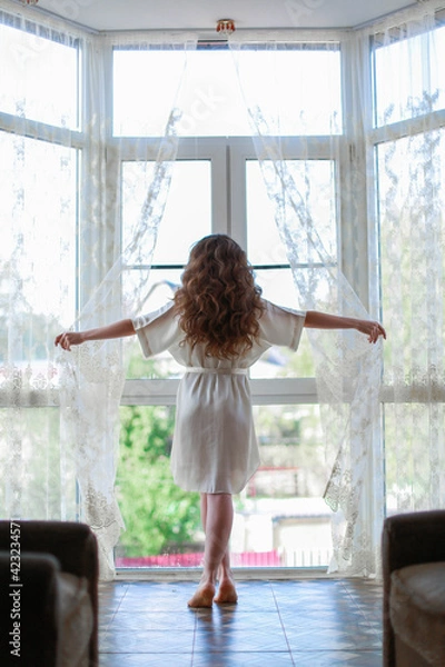 Obraz girl looking out window