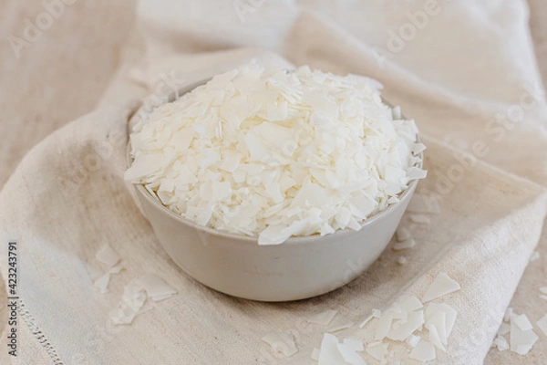 Fototapeta Soy wax in a bowl. Natural, ecological, renewable, vegan. Soy candle wax