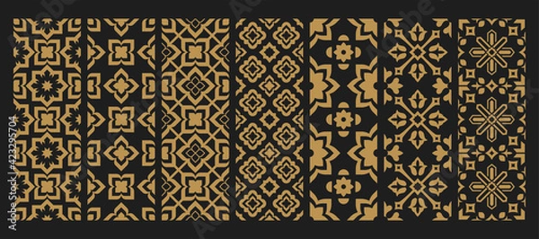 Fototapeta Set arabic oriental ornamental floral abstract arabesque seamless patterns. Golden East motif pattern on black background vector illustration