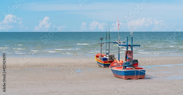 Fototapeta A fishing boat moored on the beach. They are 2 small boats that fish on the coast not too far from the sea.