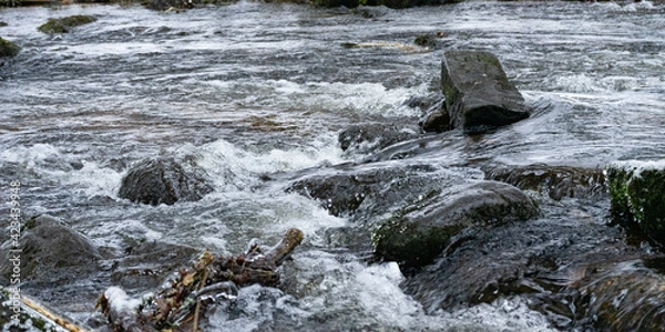 Obraz water flowing over rocks