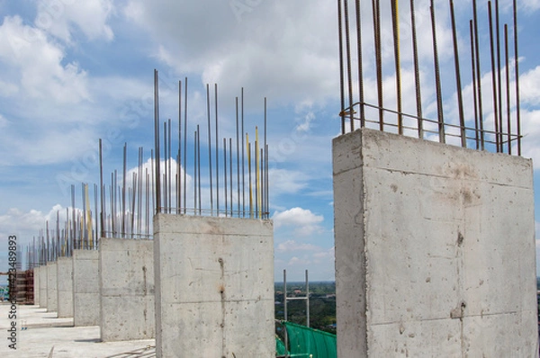 Obraz Steel reinforce in concrete column.Steel grid on the construction site.Reinforcement of concrete work. Using steel wire for securing steel bars with wire rod for reinforcement of concrete