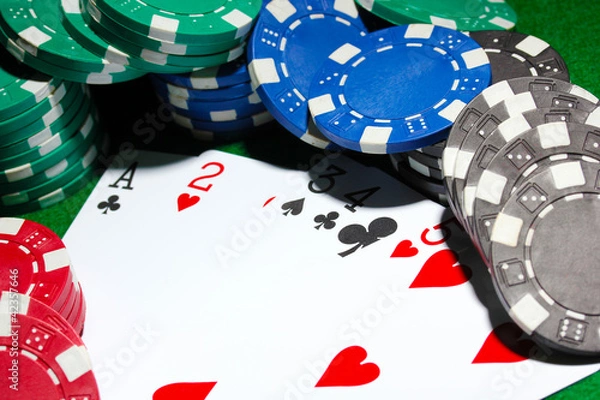 Obraz Cards and chips for poker on green table
