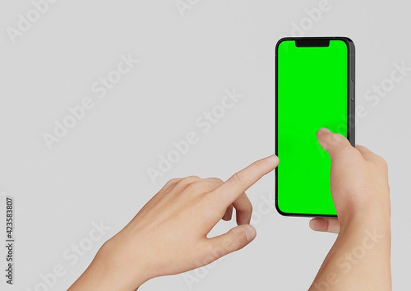 Obraz Hand or Hands holding an Iphone 12 Pro max and pointing,  3d render realistic mock up on white backgound with green screen to replace with your design