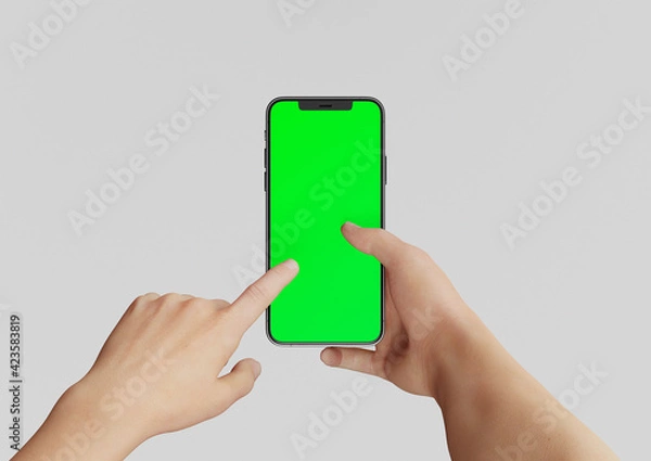 Fototapeta Hand or Hands holding an Iphone 12 Pro max and pointing,  3d render realistic mock up on white backgound with green screen to replace with your design
