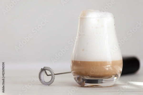 Fototapeta Milk foam maker. Mini blender, frothers for coffee, latte