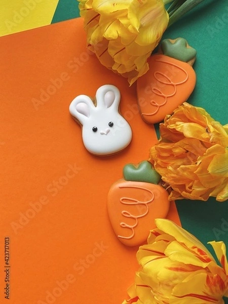 Obraz Cute white Easter bunny cookie with orange tulips 