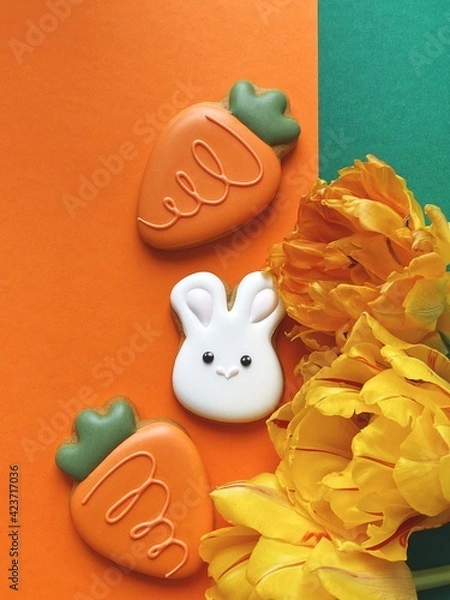 Obraz Cute white Easter bunny cookie with orange tulips 