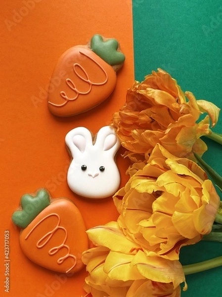 Obraz Cute white Easter bunny cookie with orange tulips 