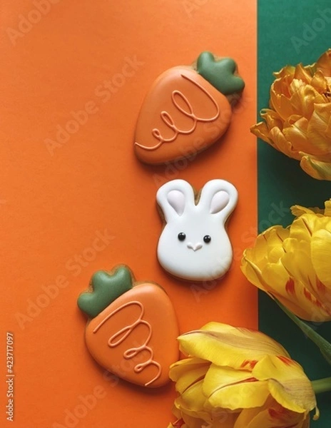 Obraz Cute white Easter bunny cookie with orange tulips 