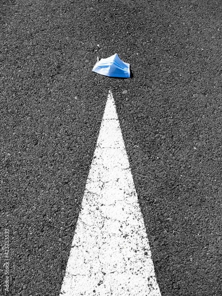 Obraz Face mask lying on asphalt