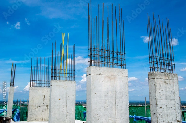 Fototapeta Steel reinforce in concrete column.Steel grid on the construction site.Reinforcement of concrete work. Using steel wire for securing steel bars with wire rod for reinforcement of concrete