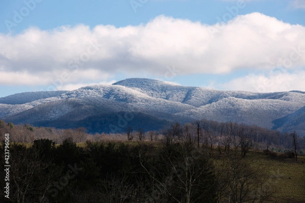 Fototapeta View of snow covered Appalachian Mountains under a blue sky in Virginia.