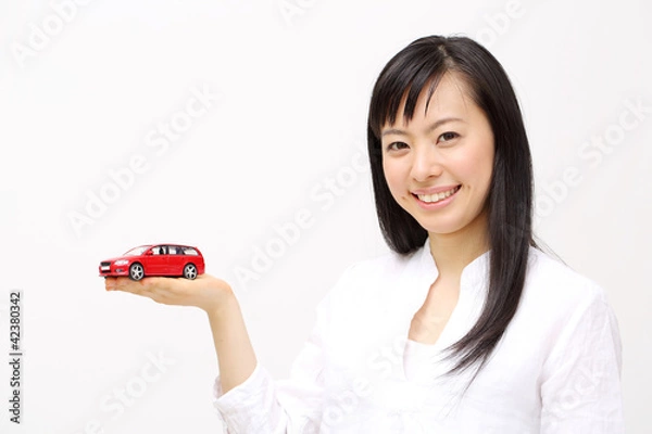 Obraz ミニカーを持つ女の子