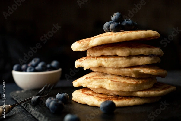 Fototapeta Stack of blueberry pancakes with syrup and fresh blueberries