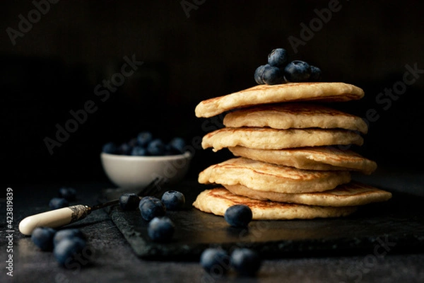 Fototapeta Stack of blueberry pancakes with syrup and fresh blueberries