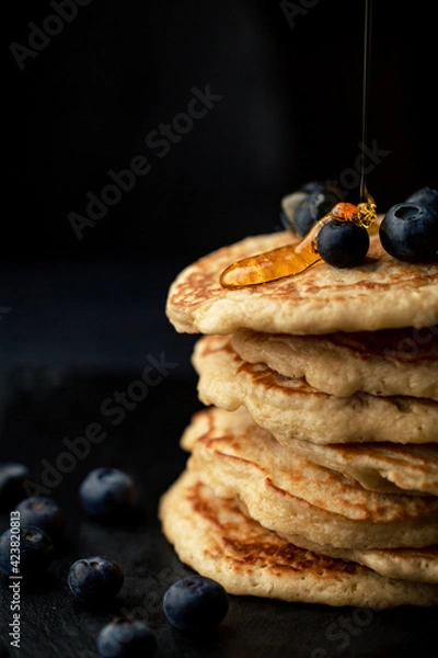 Fototapeta Stack of blueberry pancakes with syrup and fresh blueberries