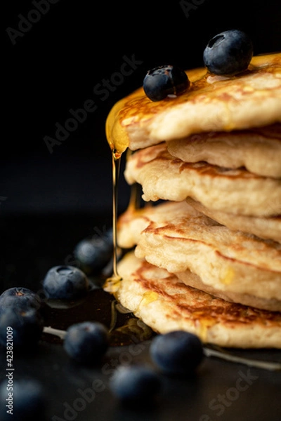 Fototapeta Stack of blueberry pancakes with syrup and fresh blueberries