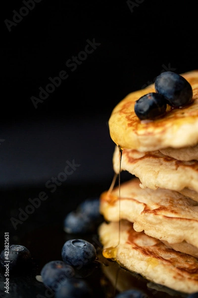 Fototapeta Stack of blueberry pancakes with syrup and fresh blueberries