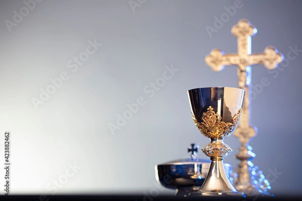 Fototapeta Religion theme – Easter. Catholic symbols composition. The Cross, monstrance  and golden chalice on blue background. 