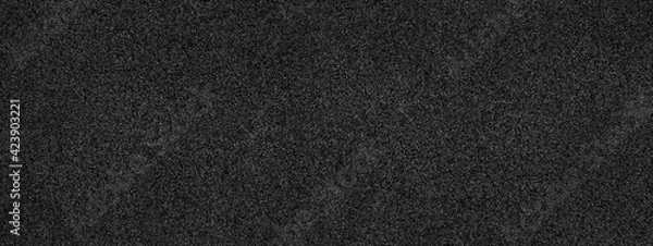 Fototapeta Black abstract background. Concrete wall finished with marble chips. Black stone background with copy space for design. Wide web banner.