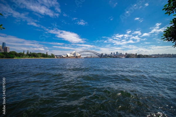 Obraz Sydney Harbour forshore viewed from the Gardens in NSW Australia on a nice sunny and partly cloudy Morning blue skies