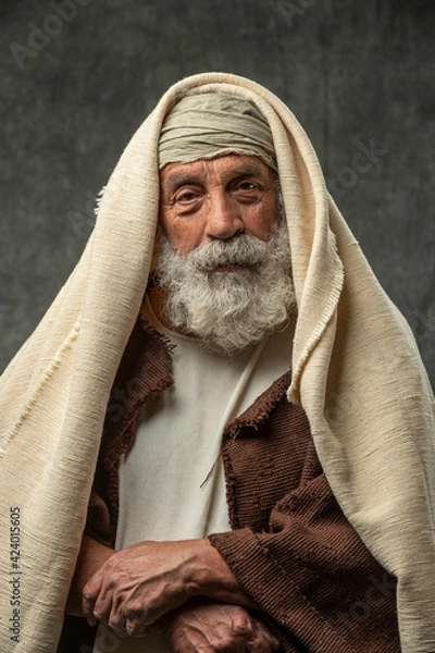 Fototapeta Old man with gray beard and wearing ancient attire