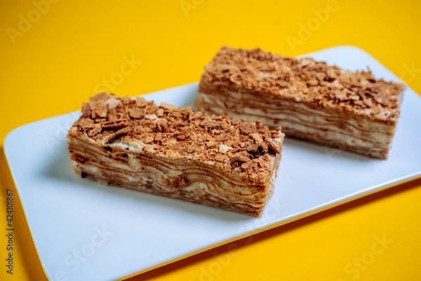 Obraz Honey cake on a yellow background