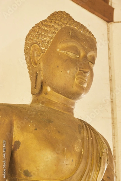 Obraz Phayao, Thailand - Dec 13, 2020: Portrait  Zoom View Front Right Buddha Statue in Sanctuary in Wat Analayo Temple