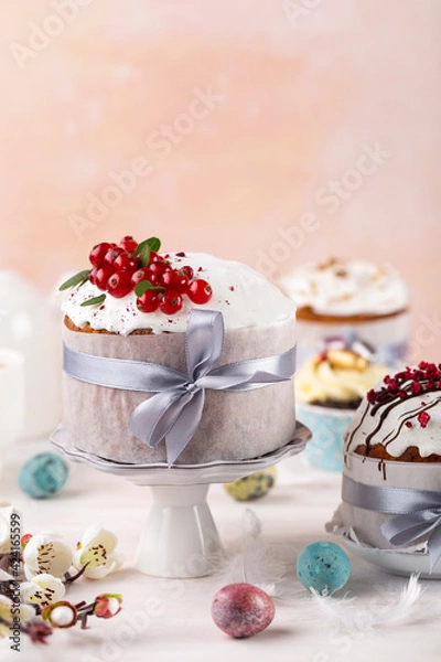 Fototapeta Various Spring Easter cakes eggs with white icing and sugar decor  and easter eggs on the  white table.  Easter concept