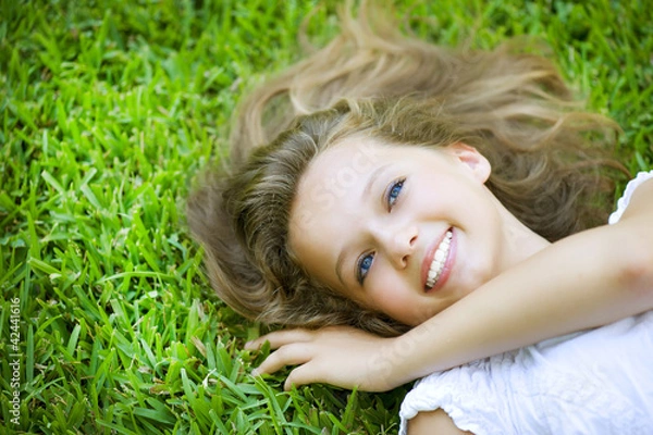 Obraz Girl lying on the Field. Happiness