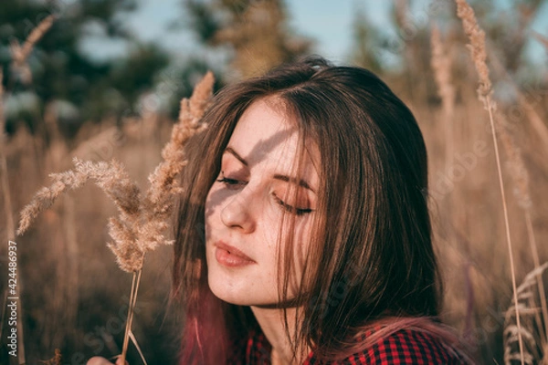 Fototapeta girl in the field enjoying the view