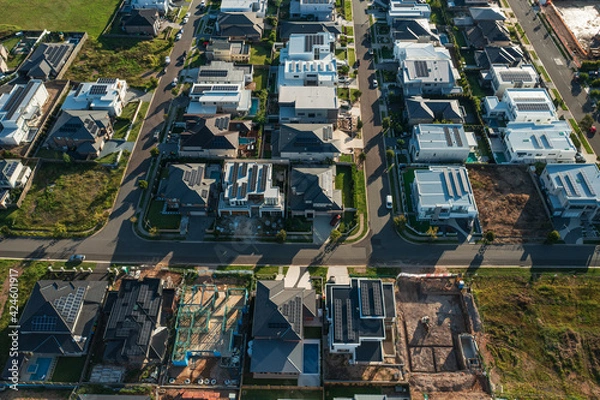 Obraz High angle aerial view of modern upmarket houses under construction many with rooftop solar, Sydney, Australia.