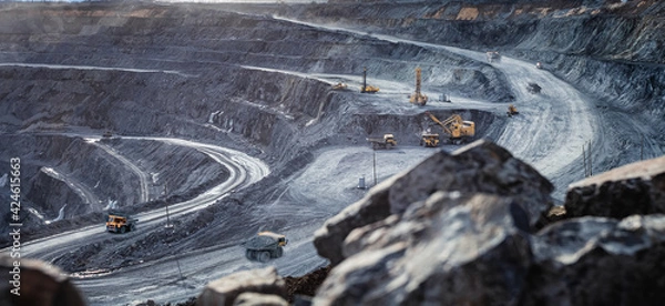 Fototapeta Work of heavy equipment in an open pit