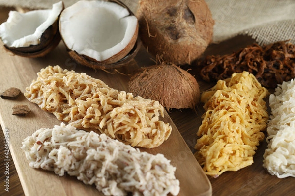 Obraz Cocada, coconut candy. Composition on wooden background