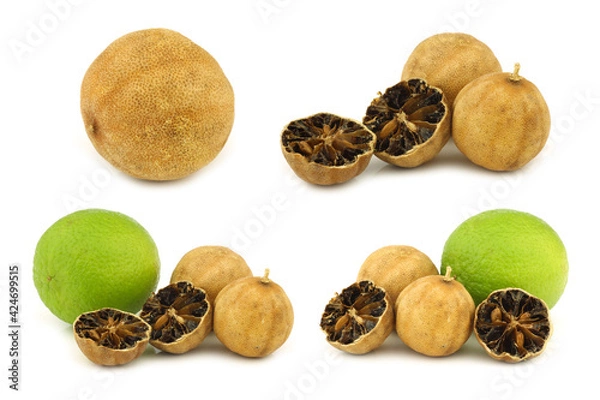 Fototapeta cut dried "white lime" fruit and a fresh one on a white background