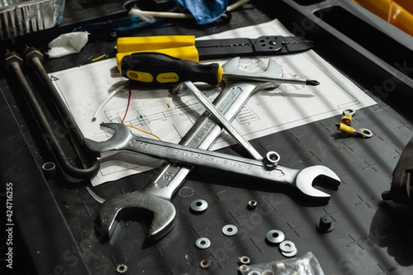 Obraz Messy set of tools on a working table in a garage