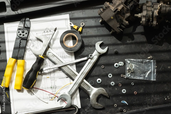 Obraz Messy set of tools on a working table in a garage