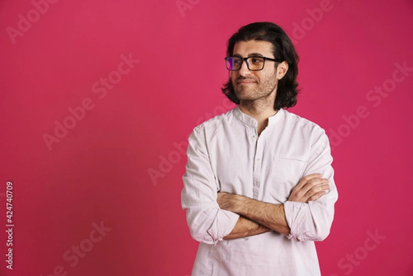 Fototapeta White brunette man in eyeglasses smiling and looking aside