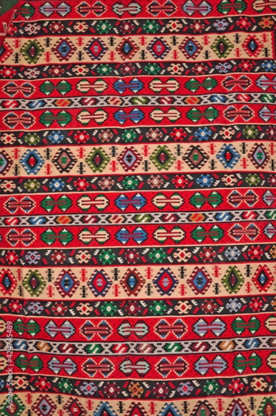 Fototapeta Segment of handmade carpets in bright colors