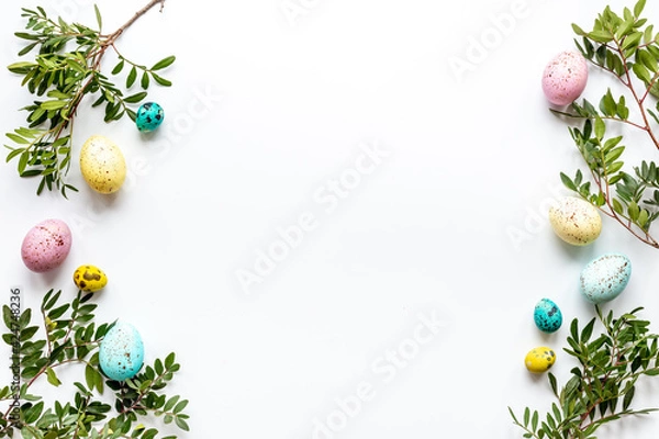 Fototapeta Happy Easter with colorful eggs and green branch, top view