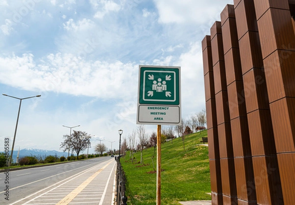 Fototapeta Assembly point signs , are essential for identifying areas of safety where persons should assemble in the event of an emergency