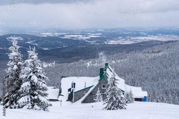 Obraz Winter mountain landscape, Poland, Panorama of the Giant Mountains in sunny winter day, from Biała Dolina in Szklarska Poreba on Szrenica and Sniezne Kotly, blue sky, white and dark clouds. Snow cover