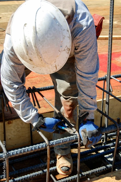 Obraz Worker tying reinforcement rebar