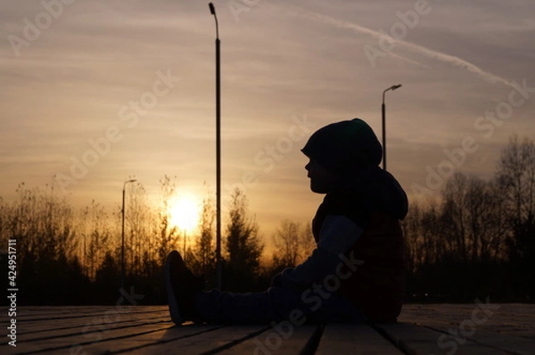 Obraz A child at sunset