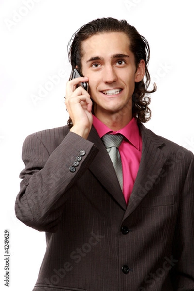 Fototapeta emotional businessman talking by mobile phone. on white