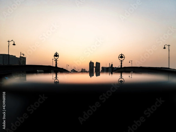 Obraz sunset in the city with reflection