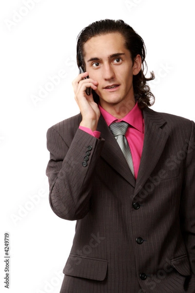 Fototapeta emotional businessman talking by mobile phone. on white