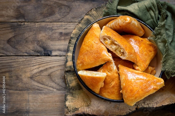 Fototapeta pies with cabbage and shortbread egg on wooden boards in a rustic style